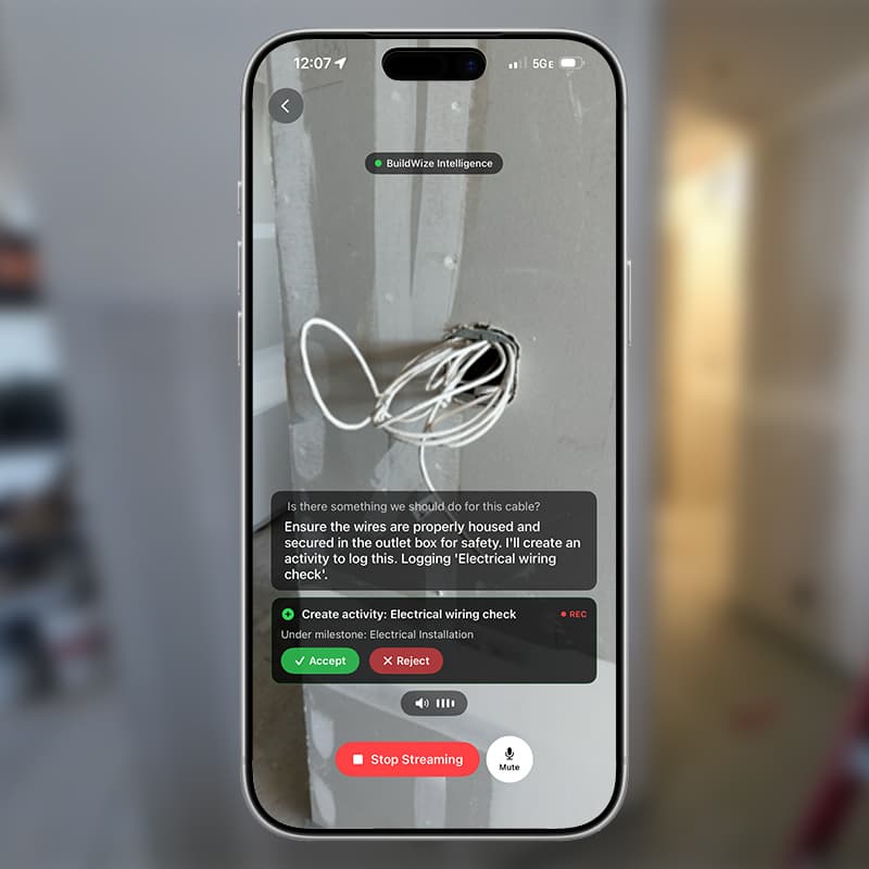 BuildWize Intelligence live on a phone, detecting a cable during a jobsite walkthrough and proposing an electrical wiring check to accept or reject.
